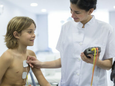 Child performing a stress test with electrodes.