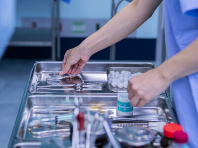 Doctor preparing surgical instruments