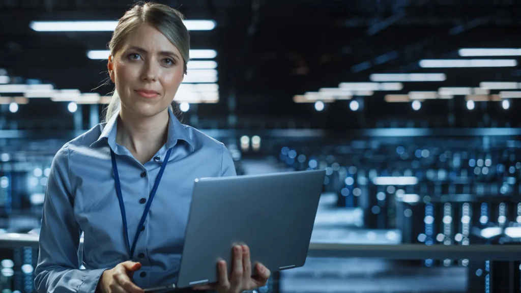 Female IT holding a laptop